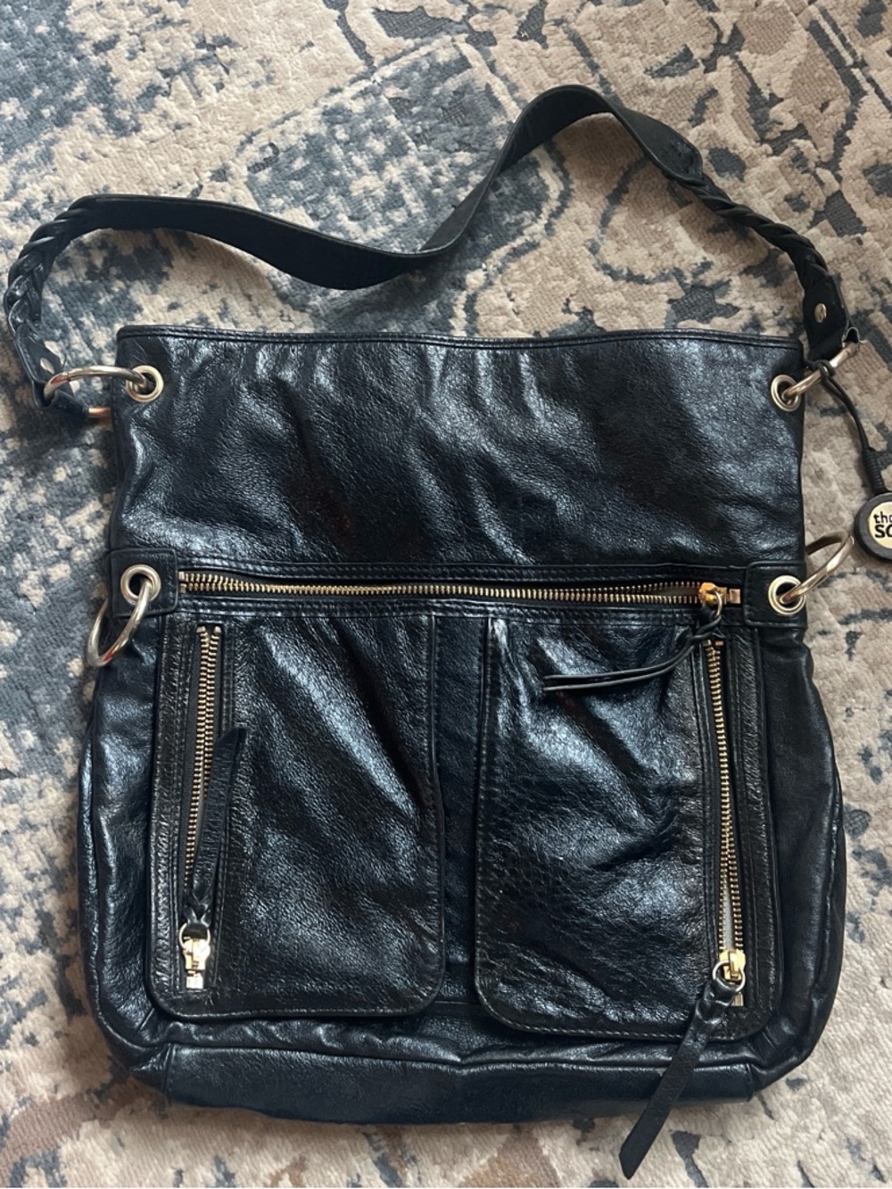 The Sak Black Leather Shoulder Bag with Gold Hardware